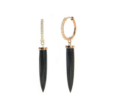 a diamond hoop in gold that has a spike hanging down that is a black spinel. 